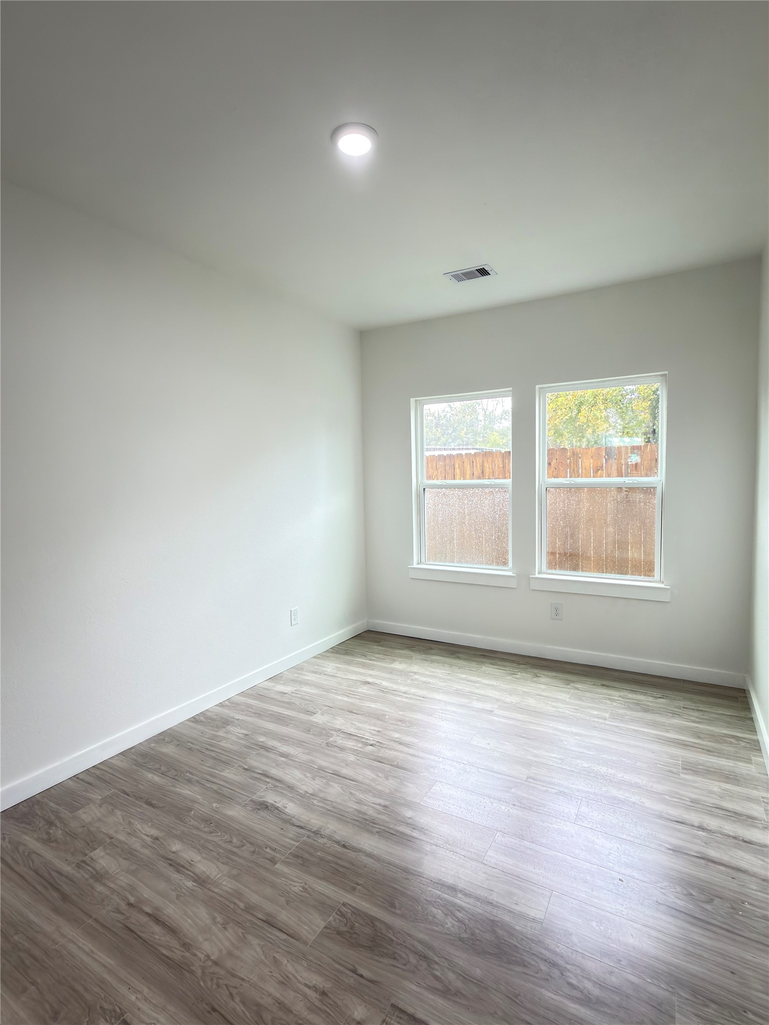 7502 Laura Koppe Road, Unit B Houston, TX 77028 - Photo 9 of 19 Spacious downstairs primary bedroom featuring a large walk-in closet and private en-suite bathroom.