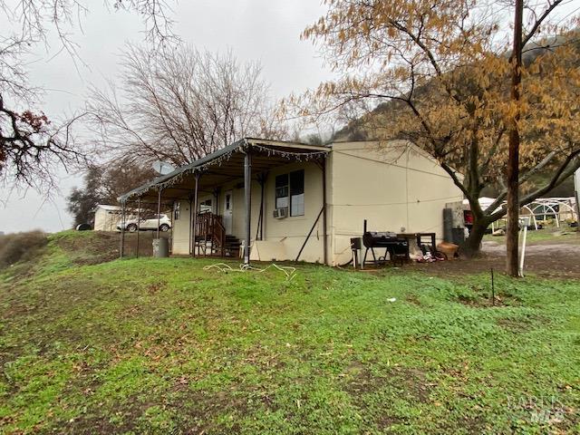 20350 Morgan Valley Road Lower Lake, CA 95457 - Photo 2 of 14 a view of a house with backyard and tree