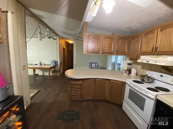 a kitchen with a sink appliances and cabinets