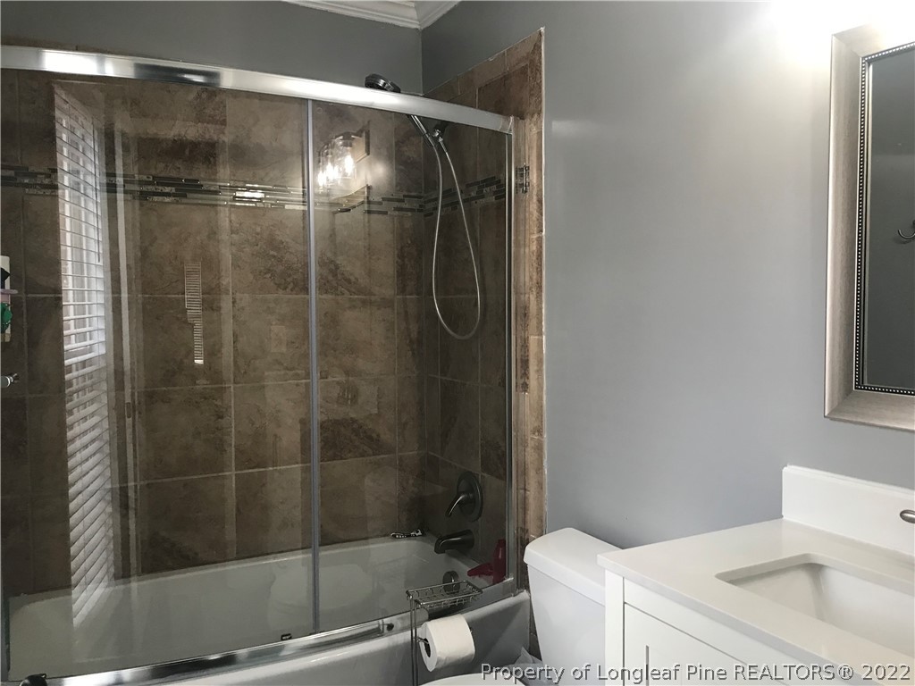 172 Tarheel Road Lumberton, NC 28358 - Photo 13 of 34 a bathroom with a shower a toilet and sink