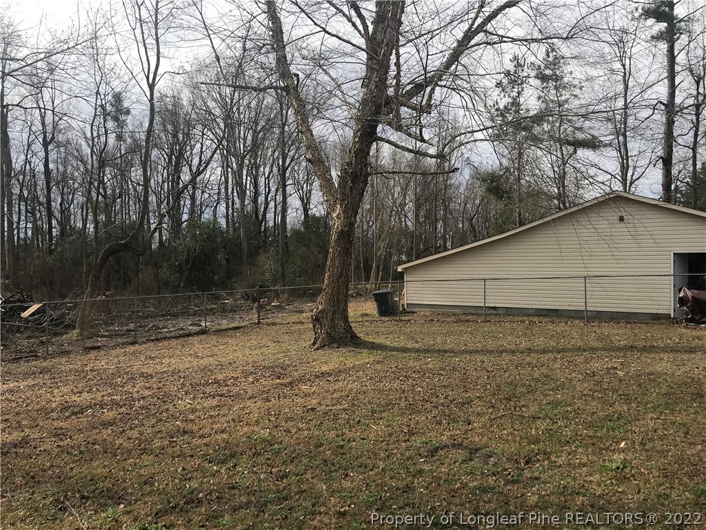 172 Tarheel Road Lumberton, NC 28358 - Photo 29 of 34 a backyard of a house with lots of green space
