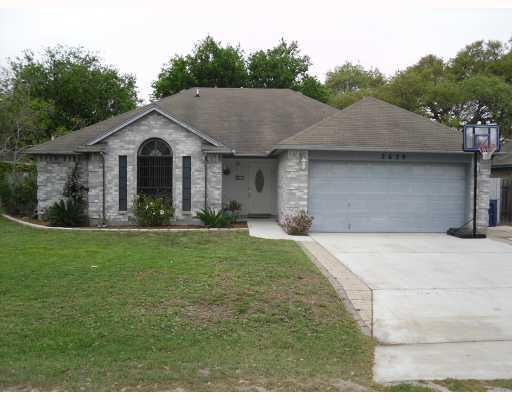 2639 Poinsetta Place Ingleside, TX 78362 - Photo 1 of 1 a front view of a house with a garden