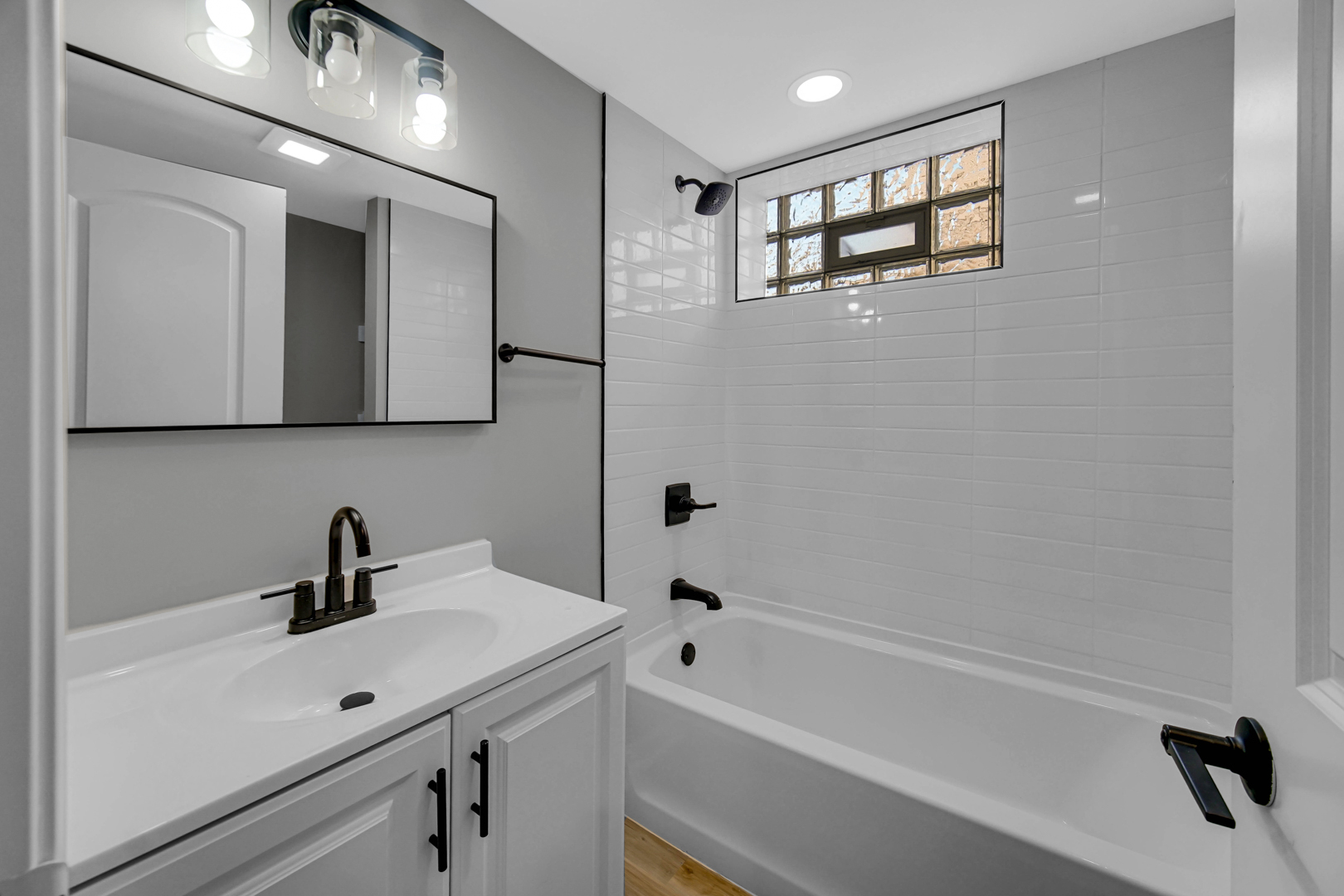 3629 West 84th Street Chicago, IL 60652 - Photo 12 of 23 a bathroom with a sink a toilet and shower