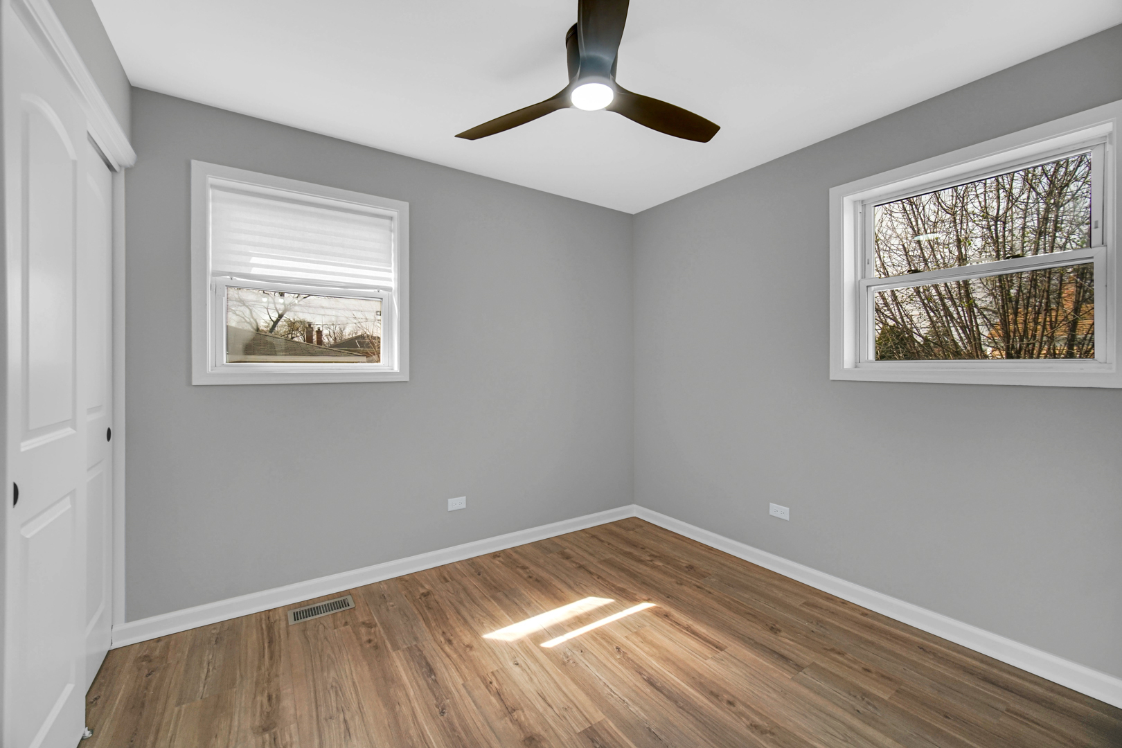 3629 West 84th Street Chicago, IL 60652 - Photo 14 of 23 a view of empty room with wooden floor and fan