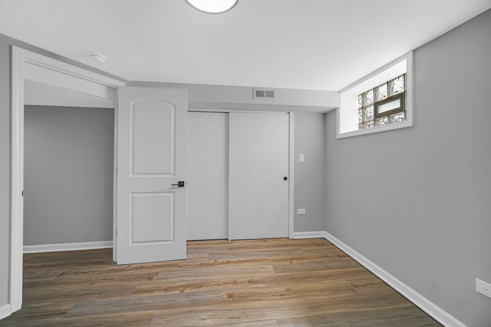 3629 West 84th Street Chicago, IL 60652 - Photo 18 of 23 a view of an empty room with wooden floor