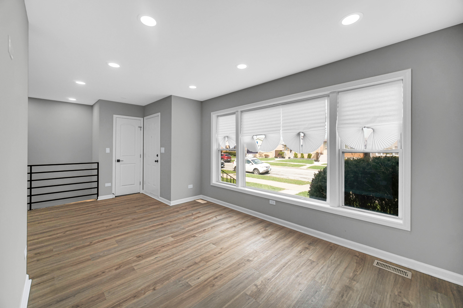 3629 West 84th Street Chicago, IL 60652 - Photo 19 of 23 a view of an empty room with a window and wooden floor