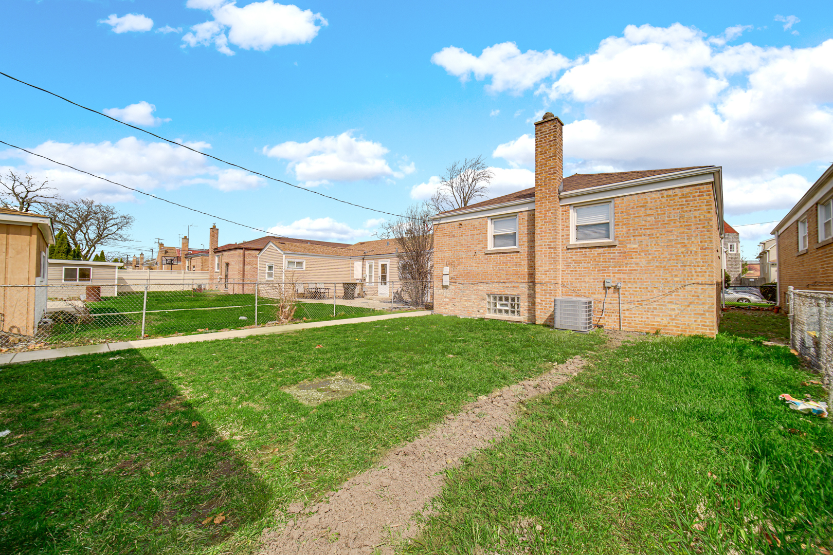 3629 West 84th Street Chicago, IL 60652 - Photo 22 of 23 a view of a backyard with plants and a garden