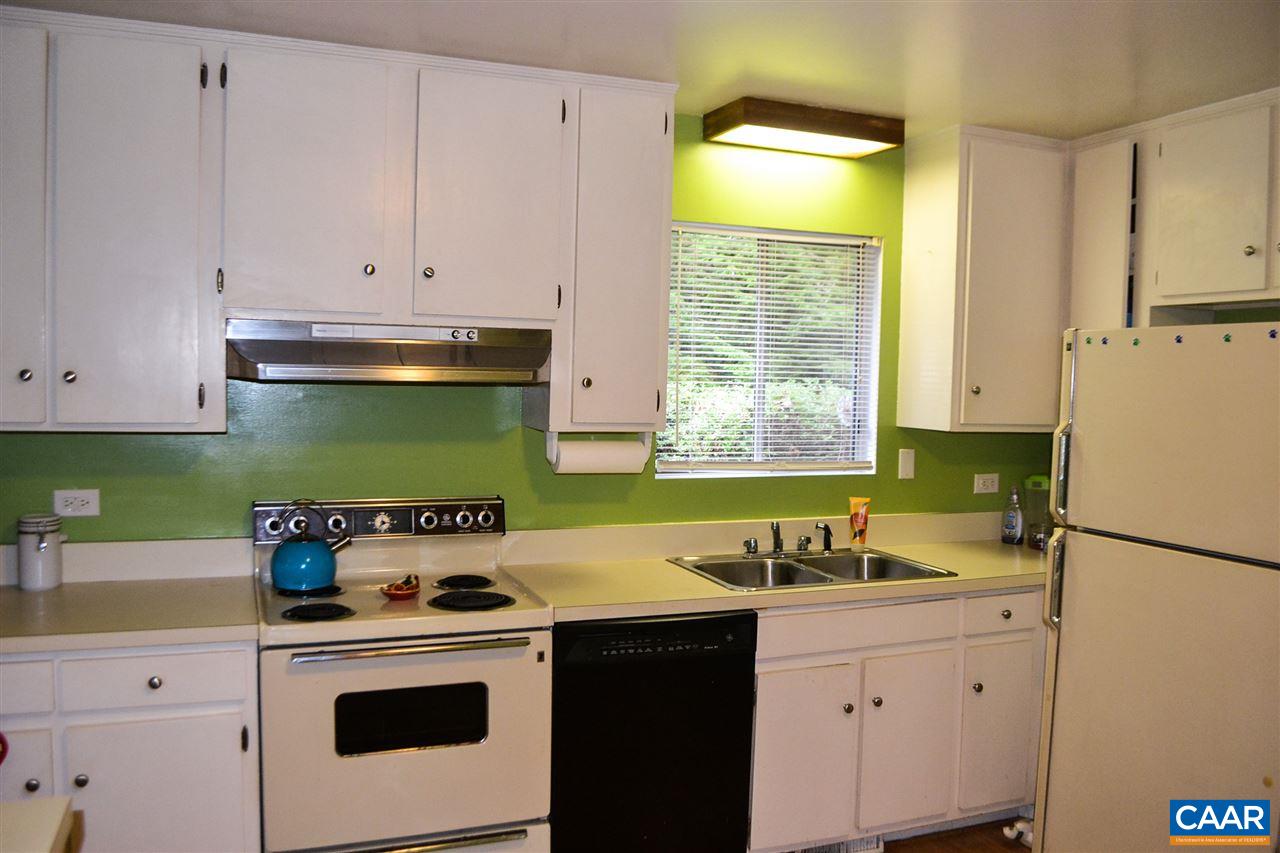 703 Shamrock Road Charlottesville, VA 22903 - Photo 13 of 36 a kitchen with a sink a stove and cabinets