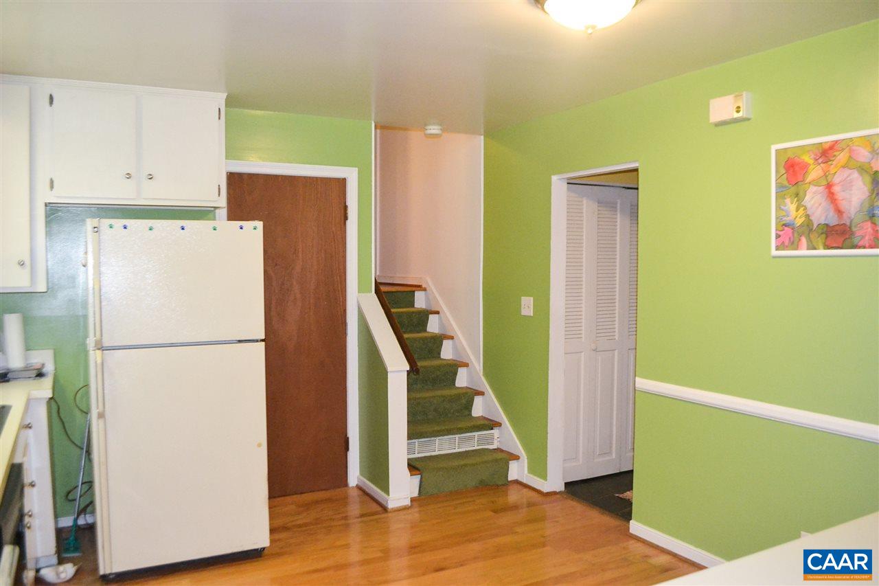 703 Shamrock Road Charlottesville, VA 22903 - Photo 16 of 36 a white refrigerator freezer and a wooden floor