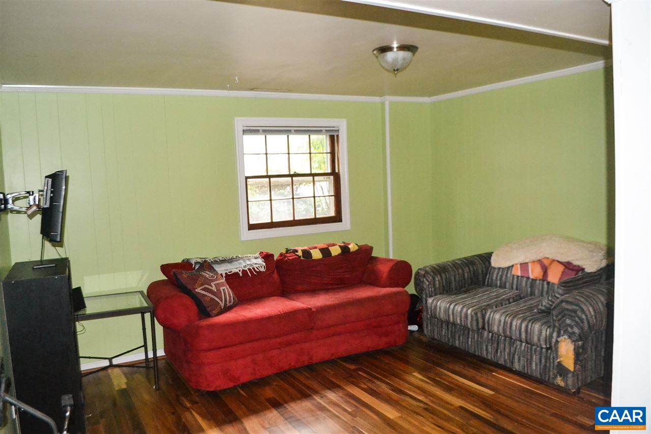 703 Shamrock Road Charlottesville, VA 22903 - Photo 20 of 36 a living room with furniture and a window