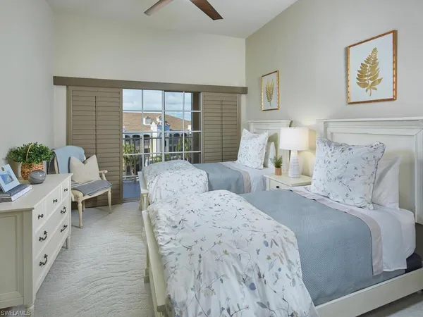 a bedroom with a bed and a couch