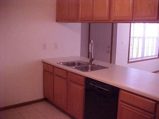 2000 Trillium Trail, Unit B Poplar Grove, IL 61065 - Photo 5 of 12 a bathroom with a sink and a mirror