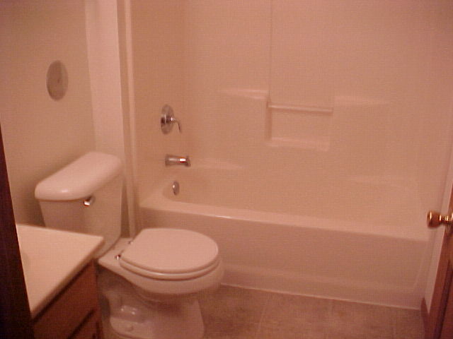 2000 Trillium Trail, Unit B Poplar Grove, IL 61065 - Photo 8 of 12 a bathroom with a toilet and a shower