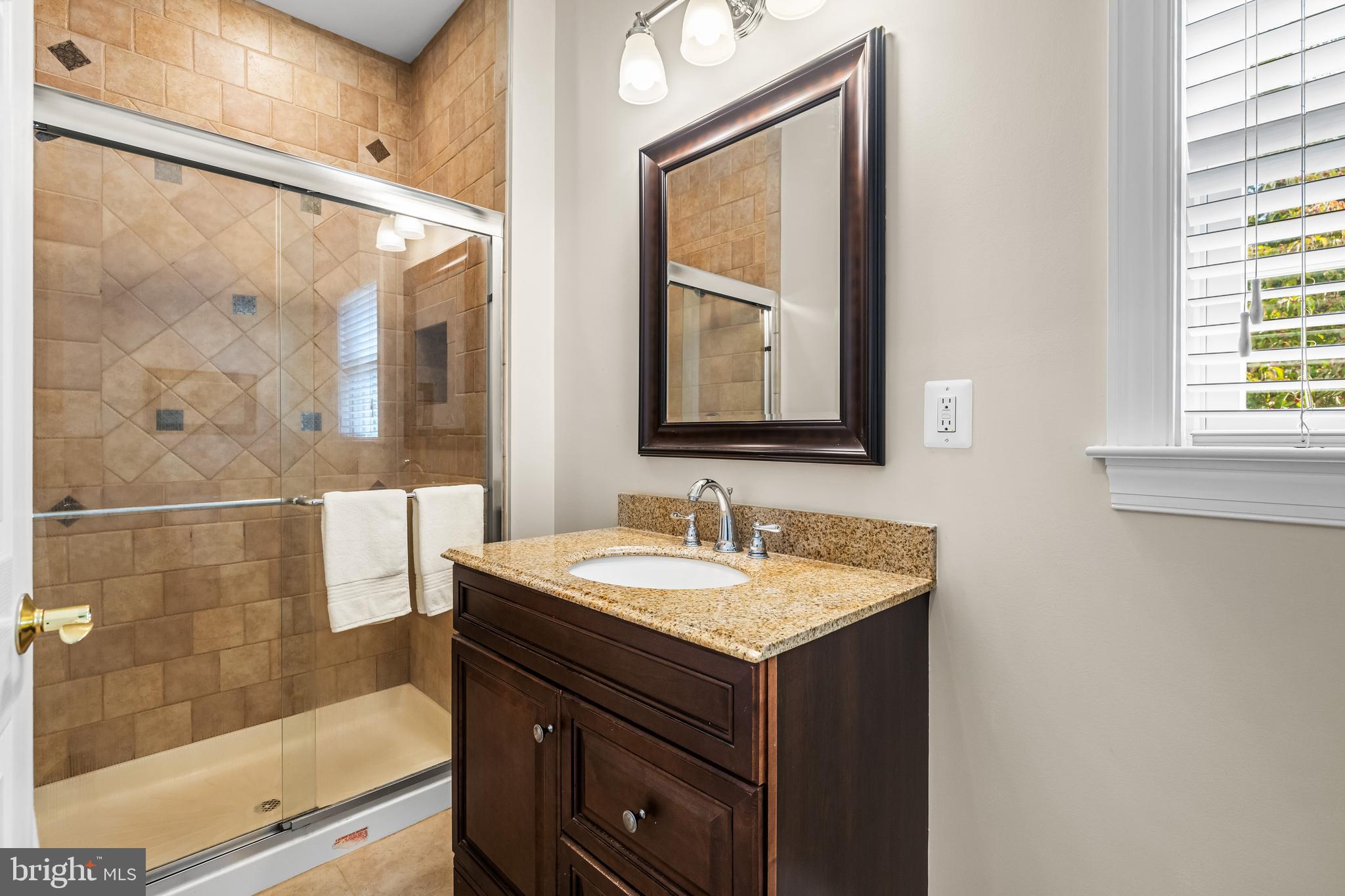 12519 Falls Road Cockeysville, MD 21030 - Photo 27 of 71 a bathroom with a sink and a mirror
