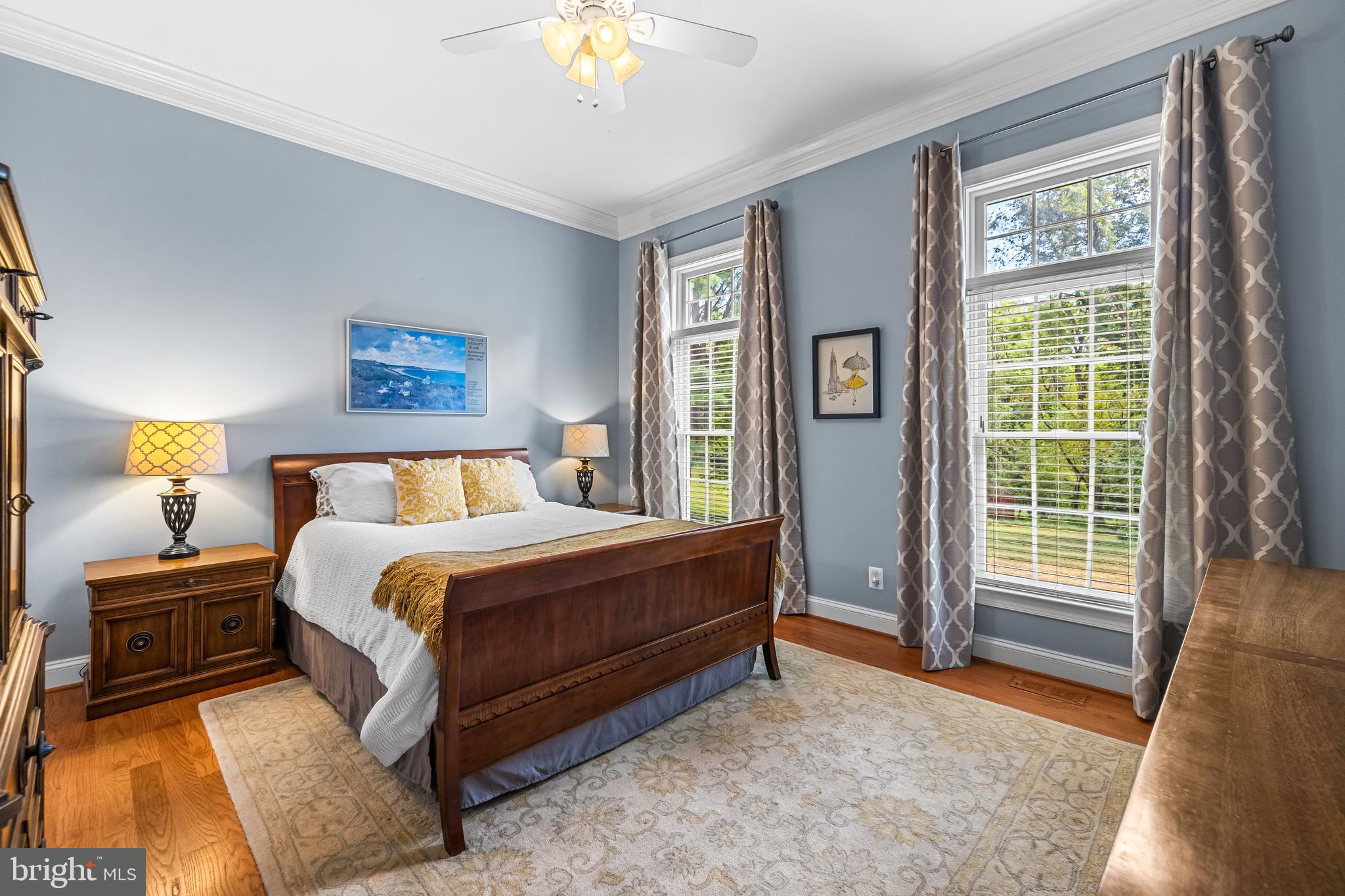 12519 Falls Road Cockeysville, MD 21030 - Photo 31 of 71 a spacious bedroom with a bed and a chandelier