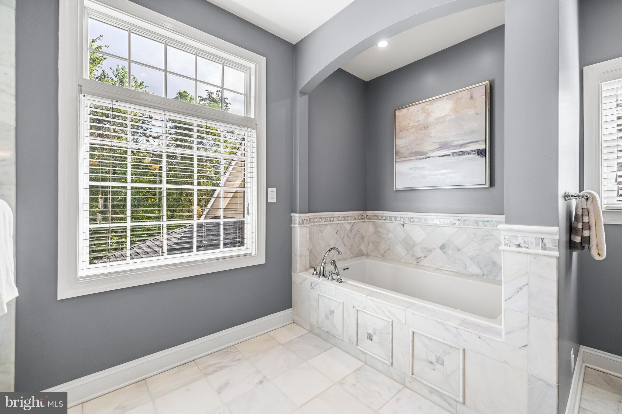 12519 Falls Road Cockeysville, MD 21030 - Photo 47 of 71 a bathroom with a bathtub and a window