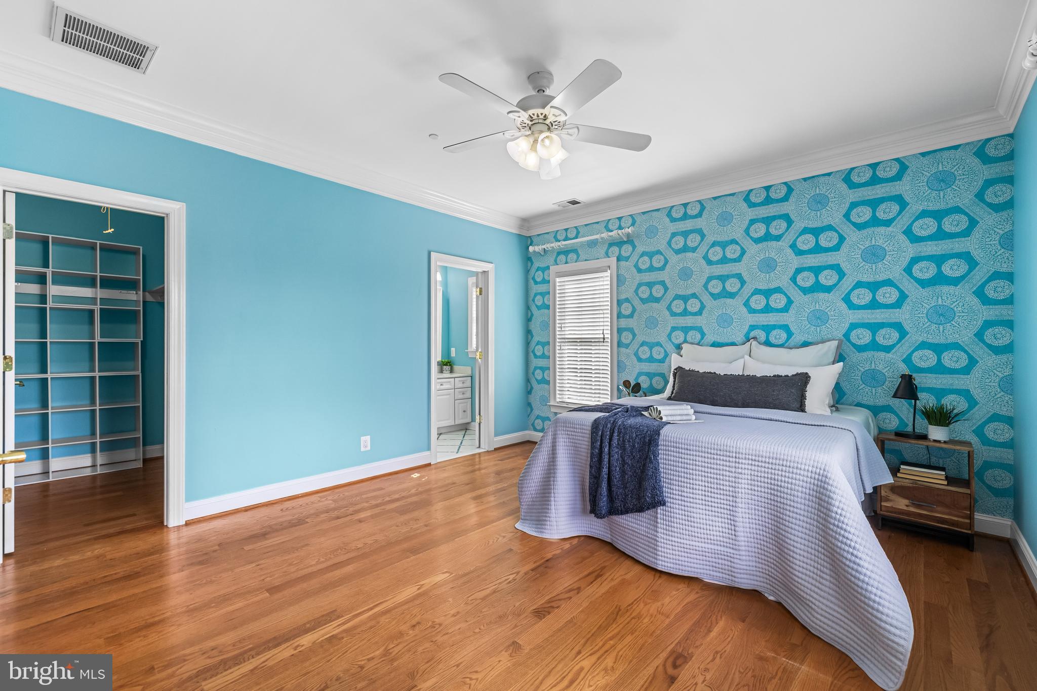 12519 Falls Road Cockeysville, MD 21030 - Photo 49 of 71 a bed sitting in a bedroom next to a window and a chandelier