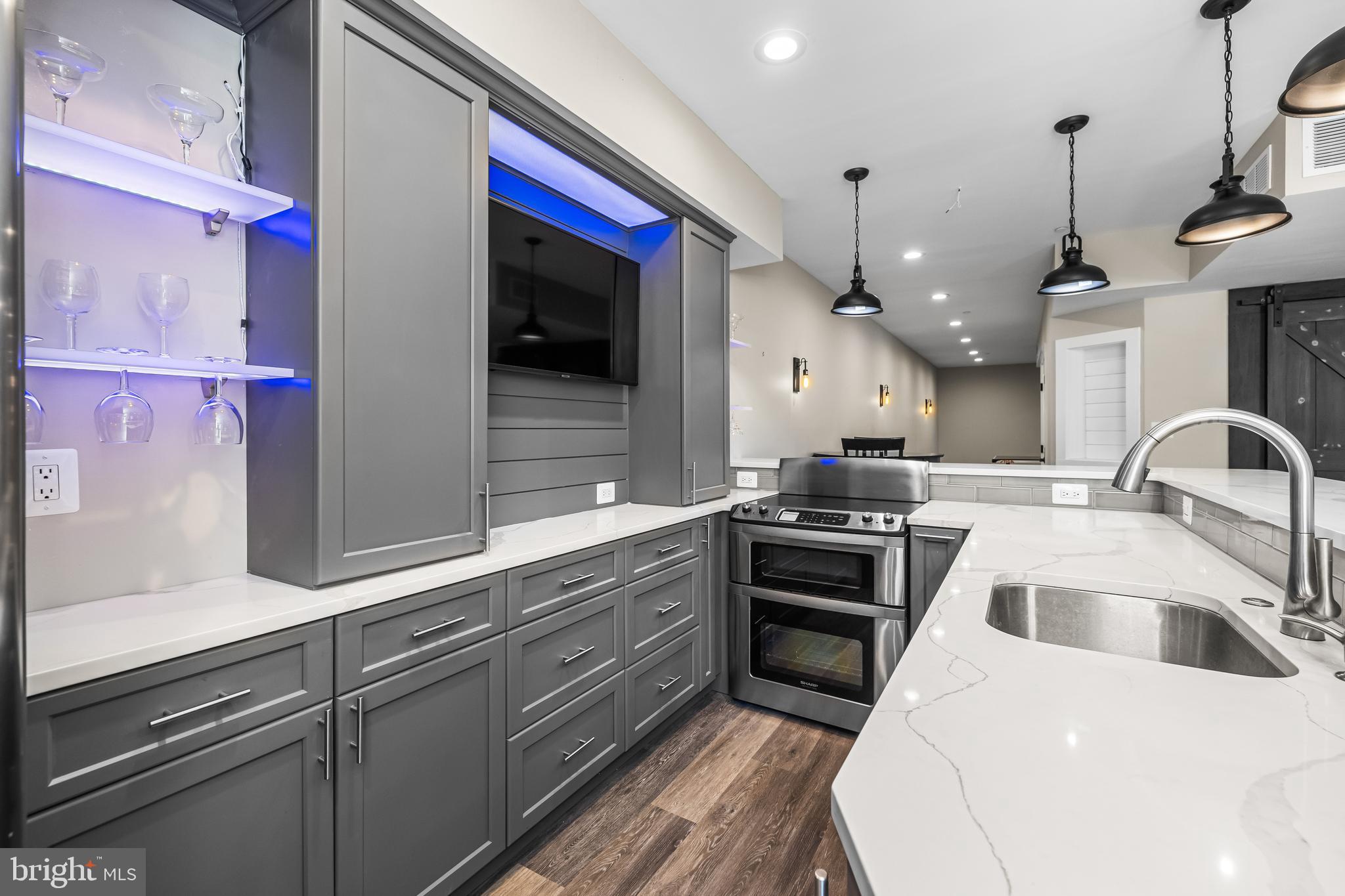 12519 Falls Road Cockeysville, MD 21030 - Photo 56 of 71 a kitchen with stainless steel appliances granite countertop a sink a stove and a refrigerator