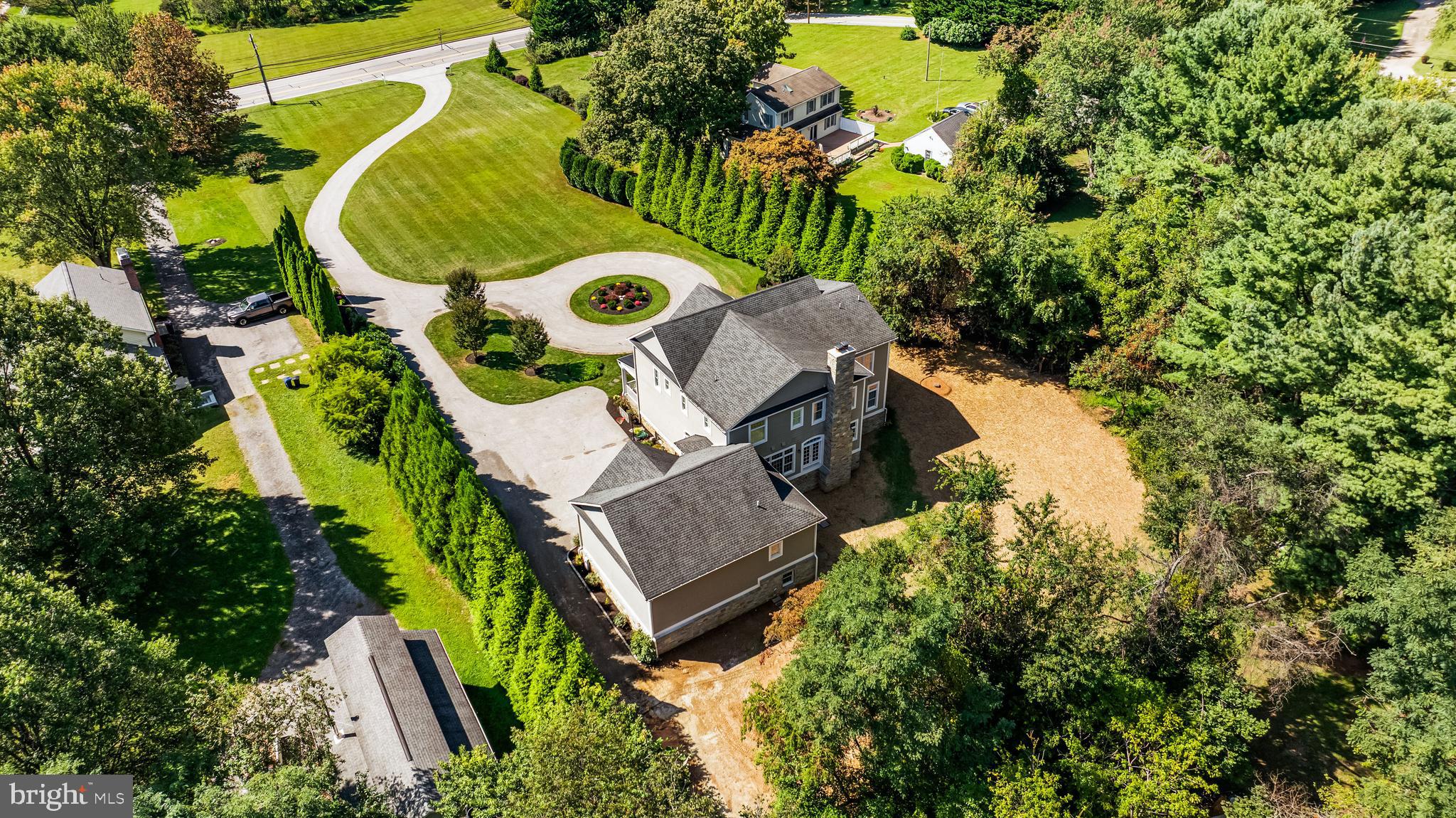 12519 Falls Road Cockeysville, MD 21030 - Photo 68 of 71 an aerial view of a house with a yard and swimming pool