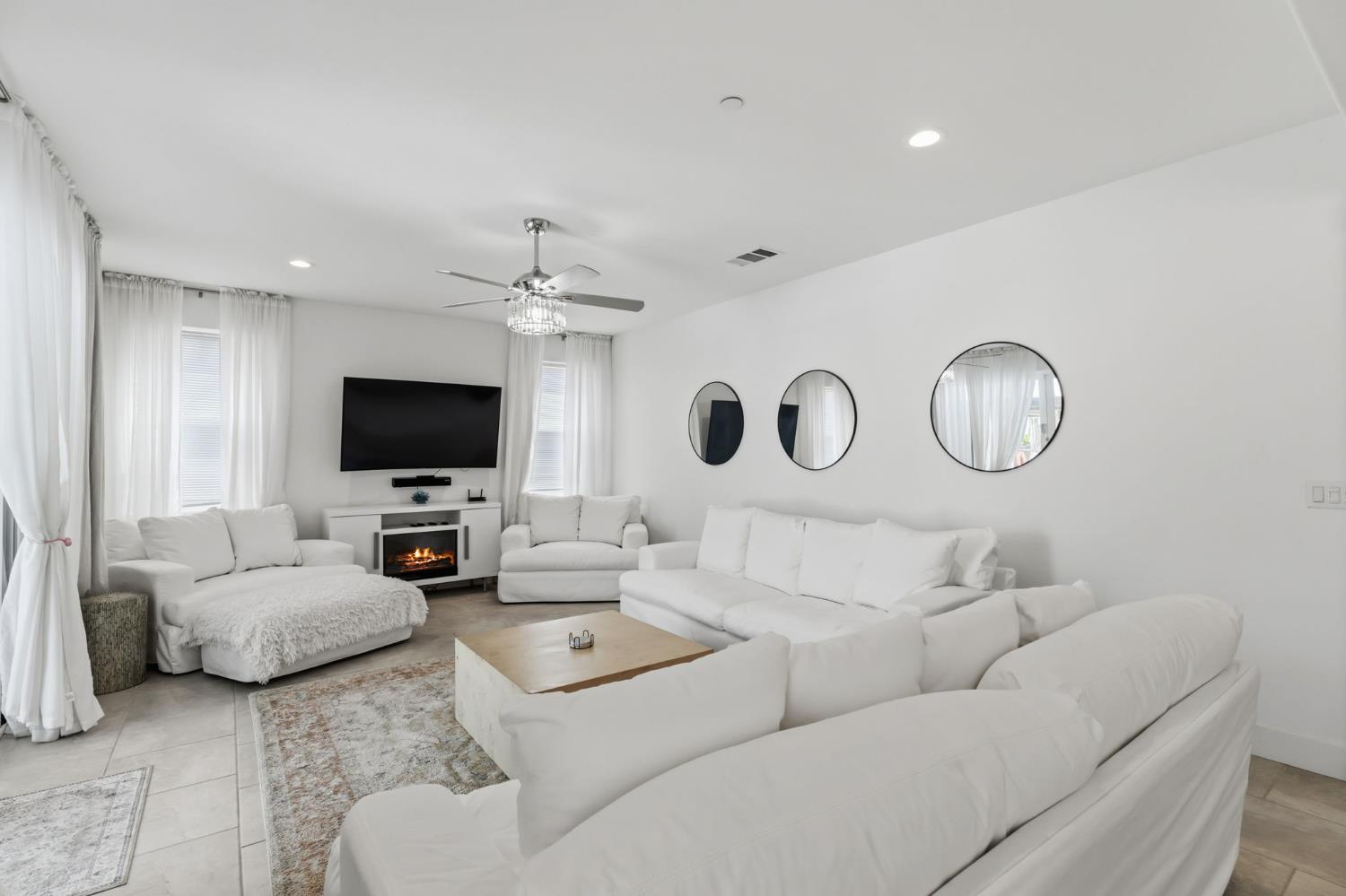 6326 West Richert Avenue Fresno, CA 93723 - Photo 14 of 45 a living room with furniture and a flat screen tv