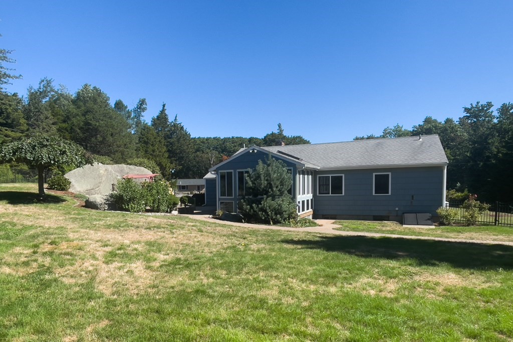 20 Locust Road Cohasset, MA 02025 - Photo 15 of 41 a front view of a house with a yard