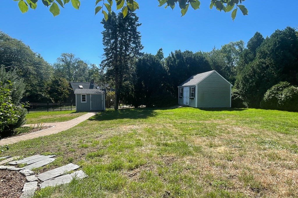 20 Locust Road Cohasset, MA 02025 - Photo 16 of 41 a view of a house with backyard and trees
