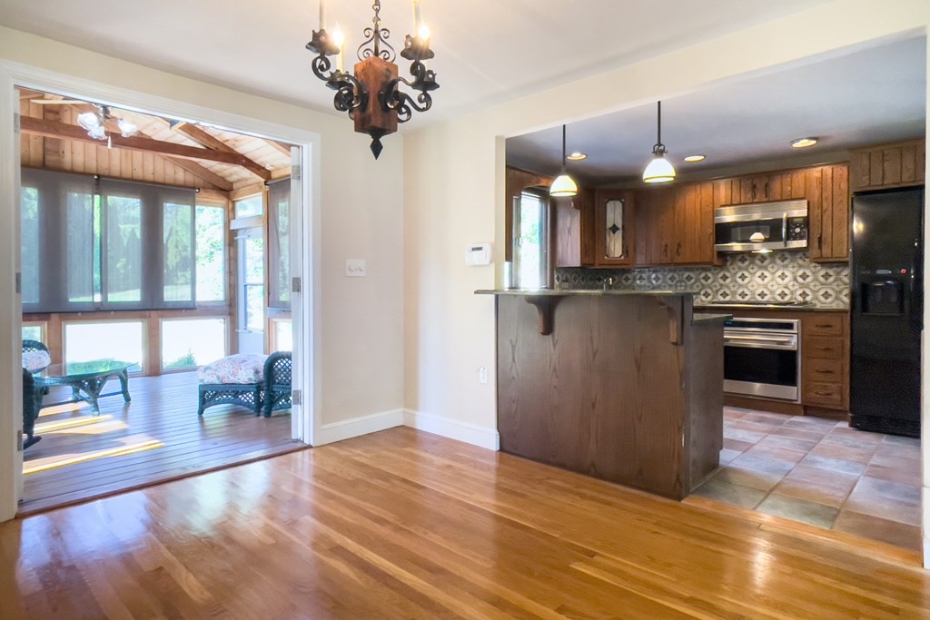 20 Locust Road Cohasset, MA 02025 - Photo 21 of 41 a view of a kitchen with a sink hardwood floor and a large window