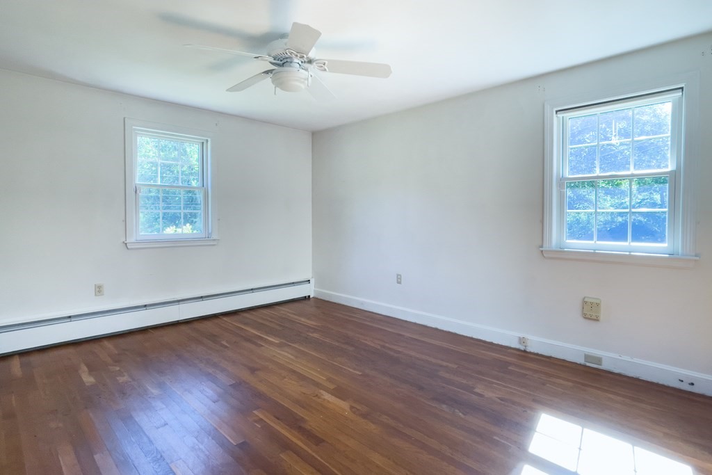 20 Locust Road Cohasset, MA 02025 - Photo 34 of 41 a view of an empty room with wooden floor and a window