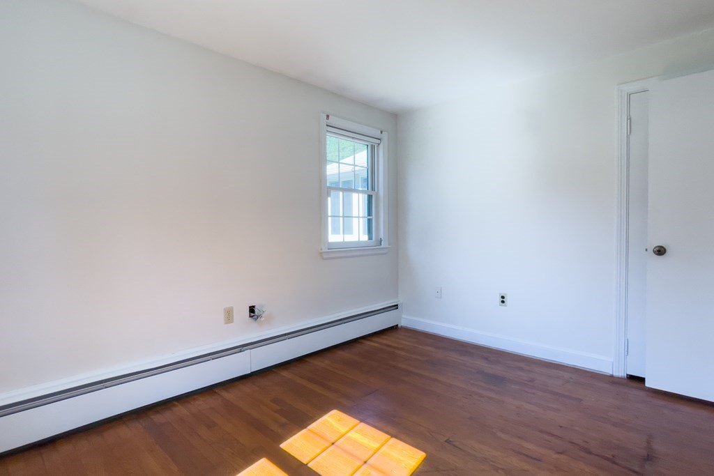 20 Locust Road Cohasset, MA 02025 - Photo 35 of 41 an empty room with wooden floor and windows