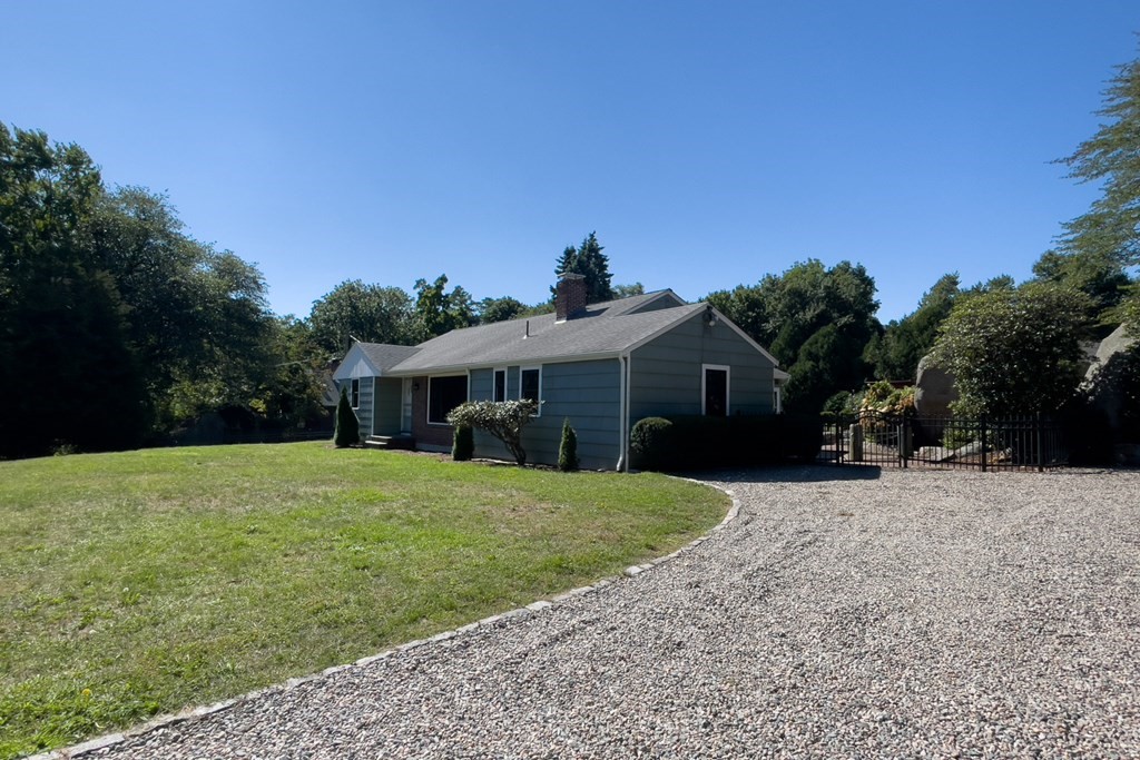 20 Locust Road Cohasset, MA 02025 - Photo 9 of 41 a front view of a house with a yard