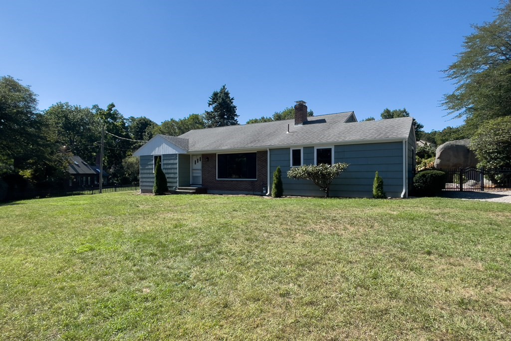 20 Locust Road Cohasset, MA 02025 - Photo 10 of 41 a front view of a house with a garden