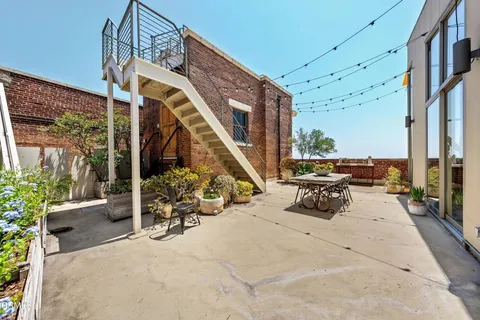 a view of a terrace with sitting area