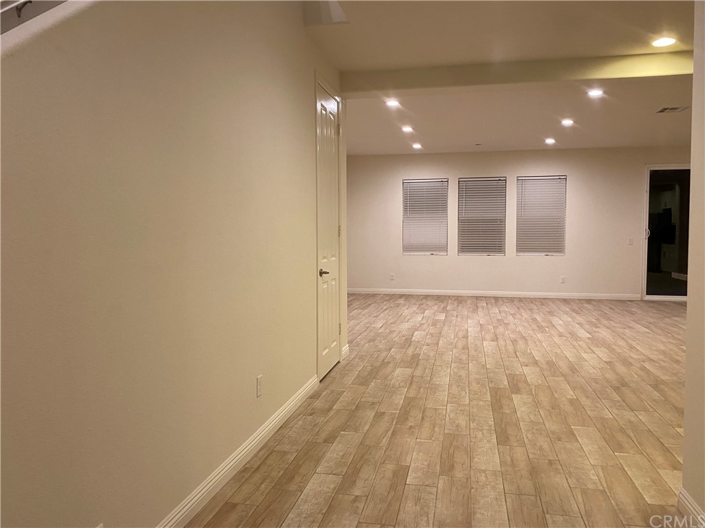 20648 Spring Street Riverside, CA 92507 - Photo 10 of 23 a view of hallway with wooden floor