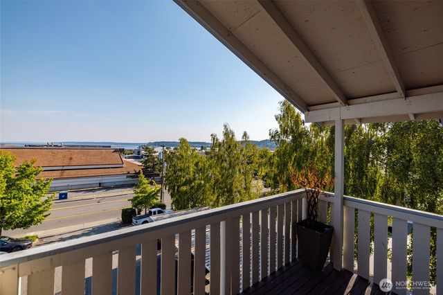 a view of a balcony with wooden fence