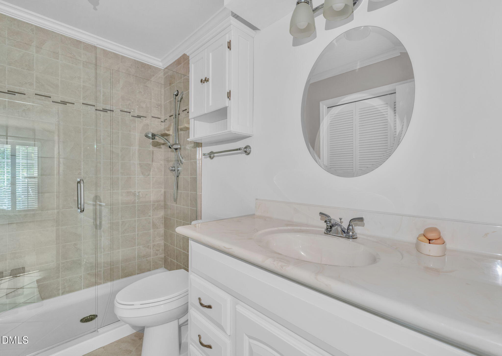 2860 Rue Sans Famille Raleigh, NC 27607 - Photo 19 of 40 a bathroom with a sink a toilet and shower