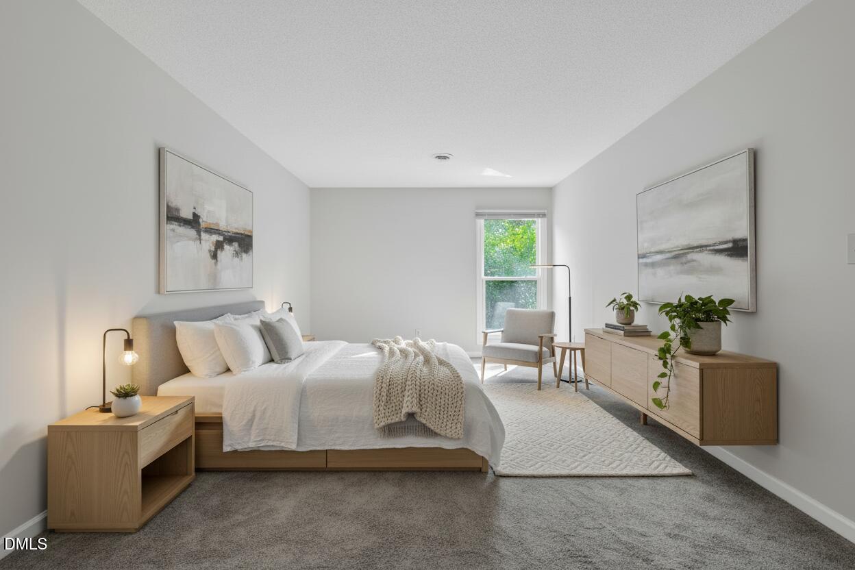 2860 Rue Sans Famille Raleigh, NC 27607 - Photo 20 of 40 a bedroom with bed and white walls