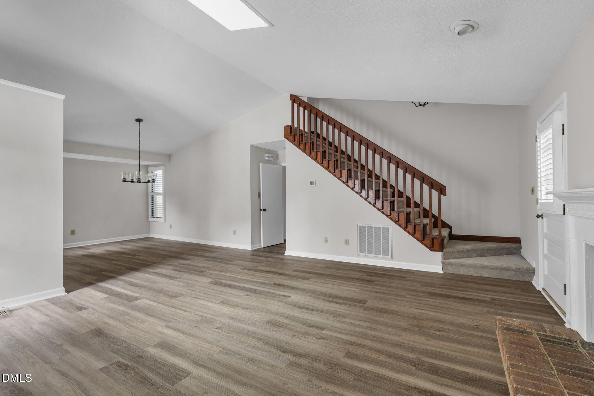 2860 Rue Sans Famille Raleigh, NC 27607 - Photo 6 of 40 a view of an entryway with wooden floor