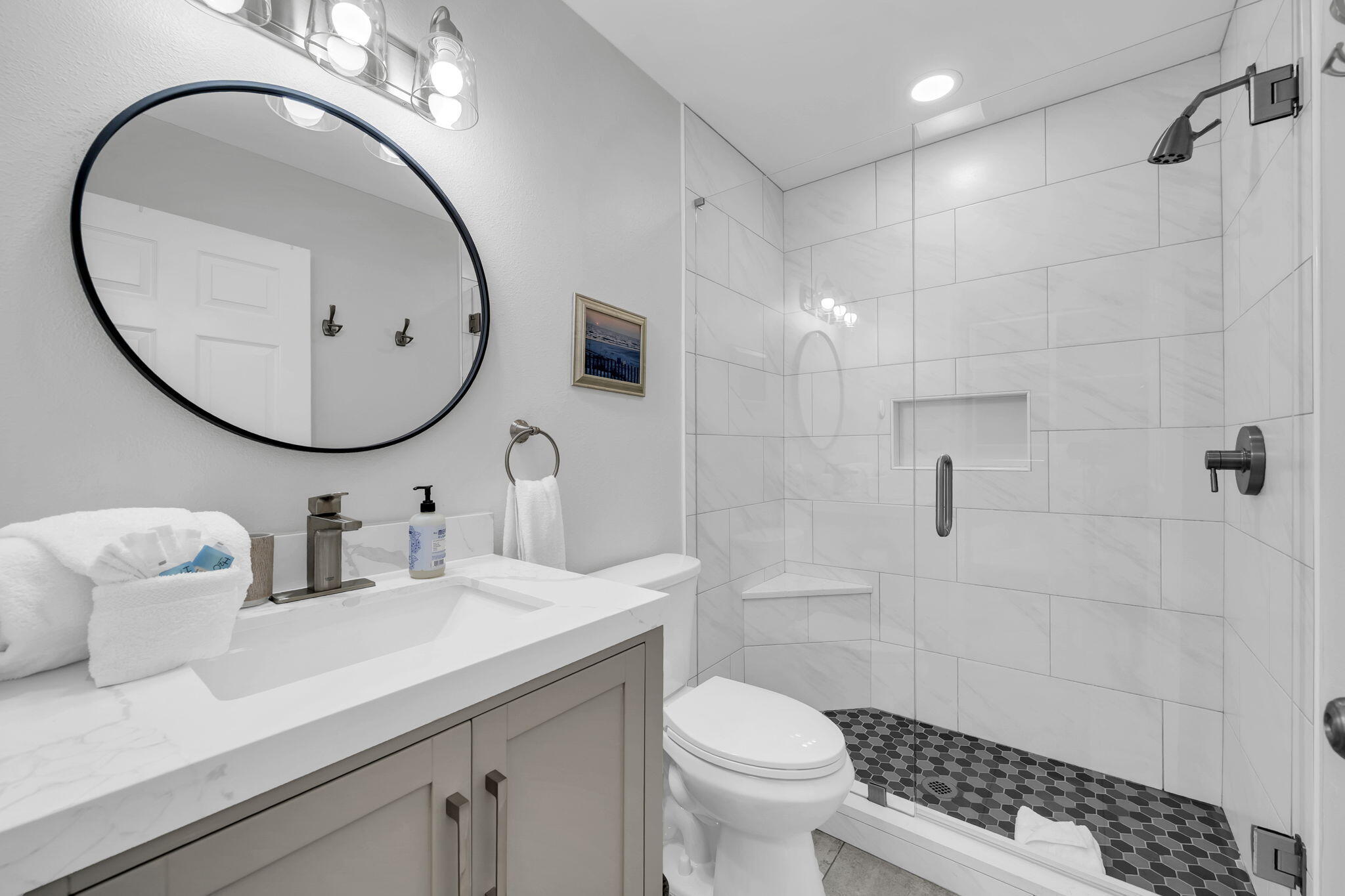 11 Beachside Drive, Unit 131 Santa Rosa Beach, FL 32459 - Photo 19 of 25 a bathroom with a toilet a sink and mirror