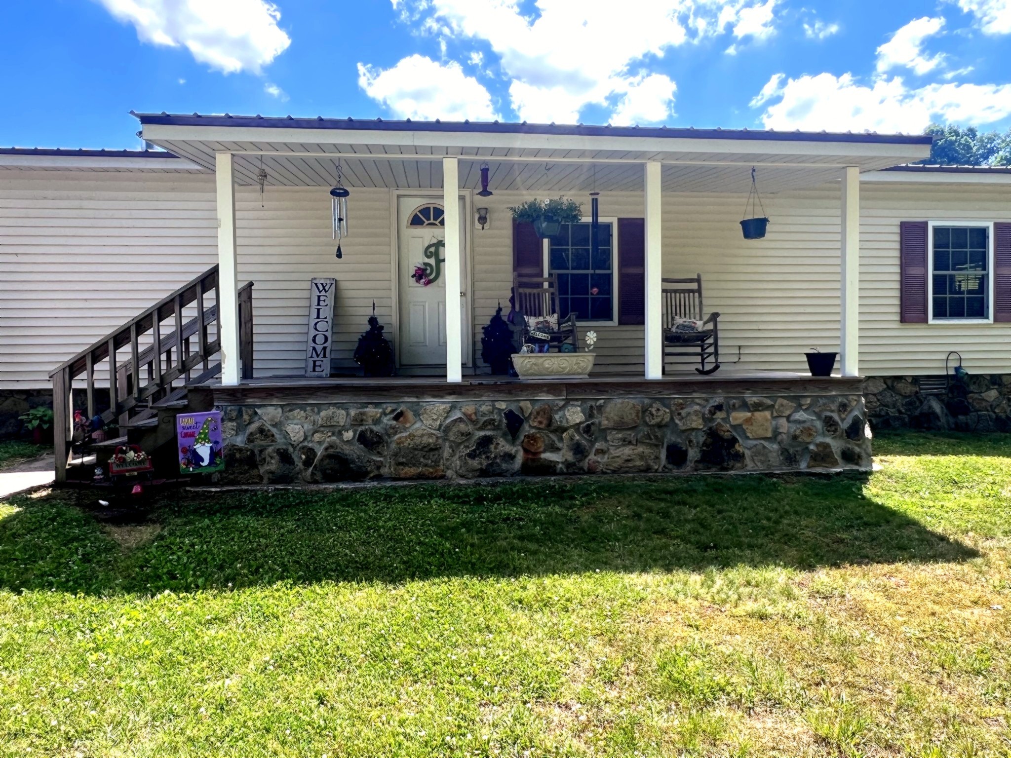 1133 Culps Bend Road Clifton, TN 38425 - Photo 5 of 51 a front view of a house with a garden