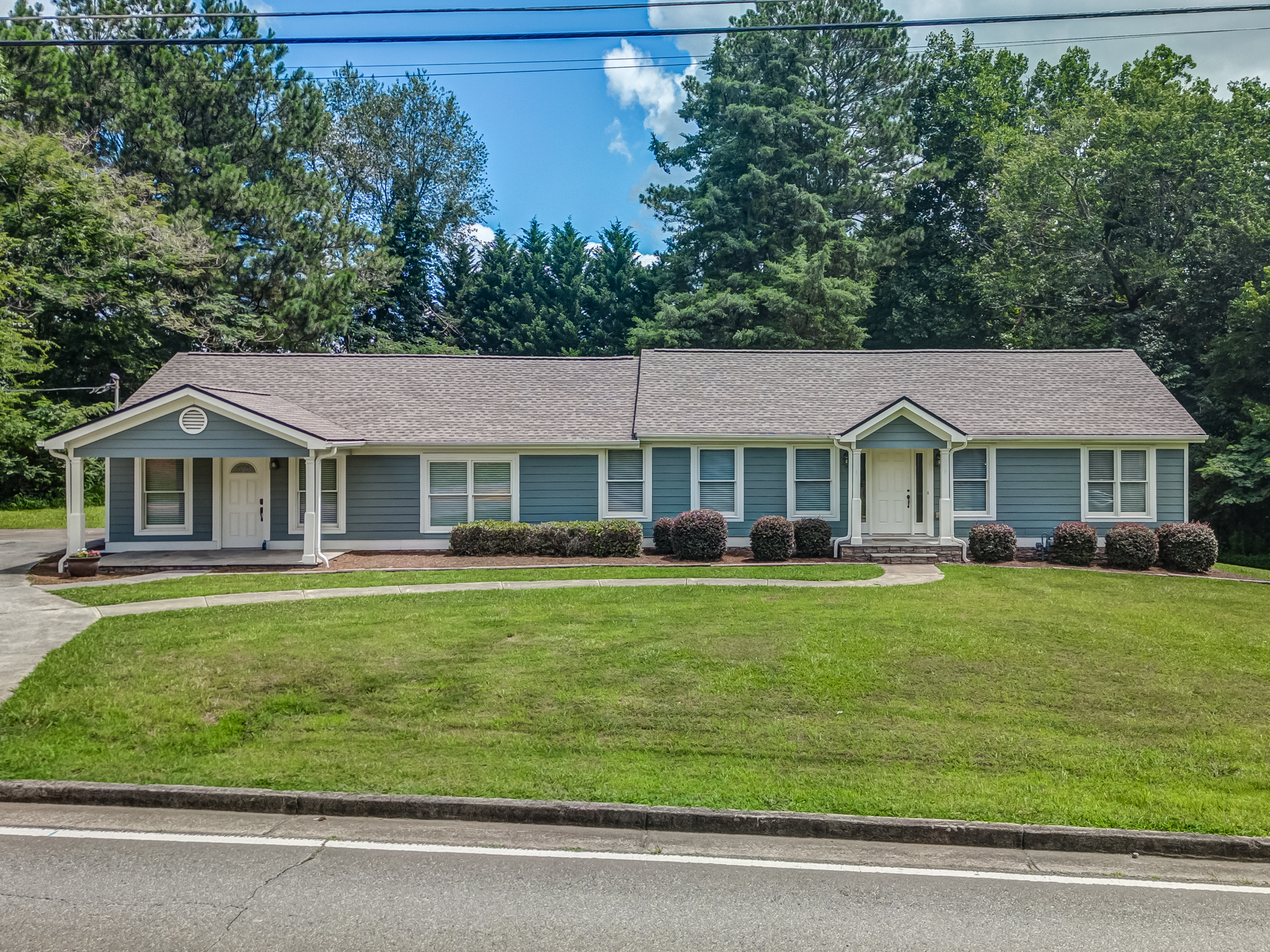 7754 Union Hill Road Canton, GA 30115 - Photo 1 of 1 a front view of a house with a garden
