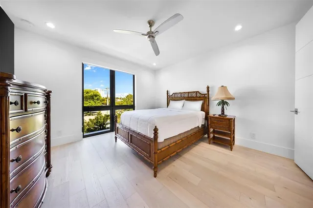 a view of a house with a yard and potted plants