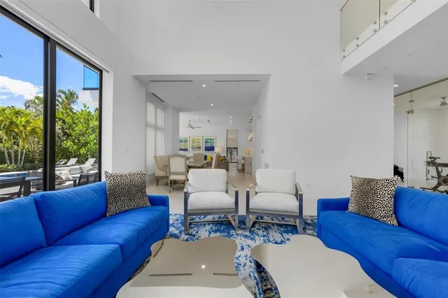 a spacious bedroom with a bed and a flat screen tv