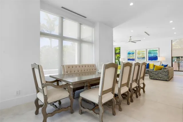 an aerial view of a house with outdoor space and lake view