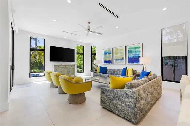 a spacious bedroom with a bed and a window