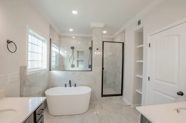 a bathroom with a bathtub and a sink