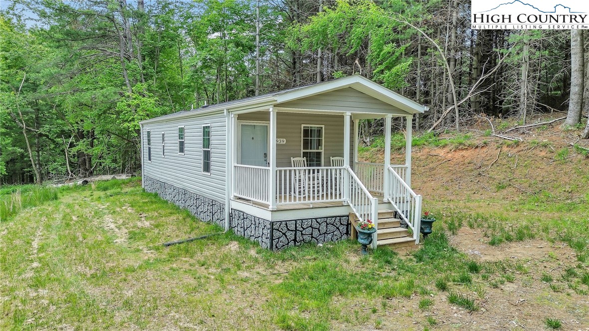 939 Don Bare Road Jefferson, NC 28640 - Photo 2 of 22 a view of a house with a yard and deck