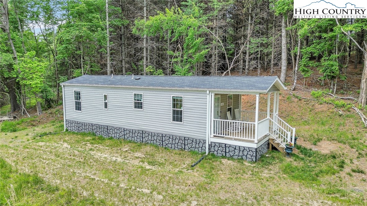 939 Don Bare Road Jefferson, NC 28640 - Photo 5 of 22 a house view with a garden space