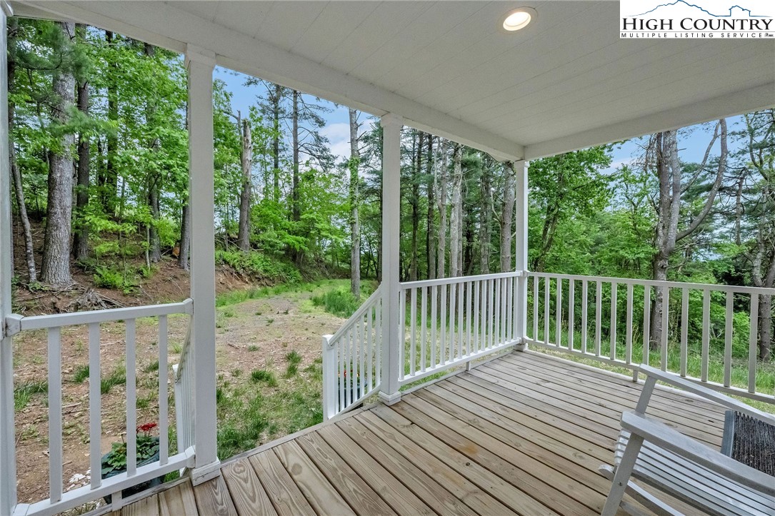939 Don Bare Road Jefferson, NC 28640 - Photo 7 of 22 a view of balcony with wooden floor