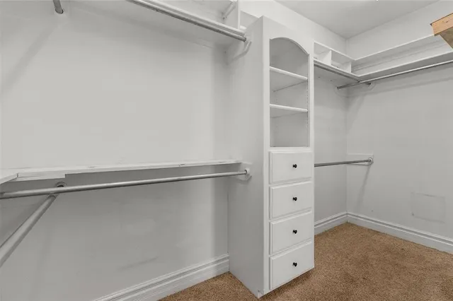 a view of an empty walk in closet