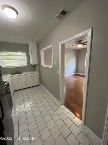 a view of an empty room and window